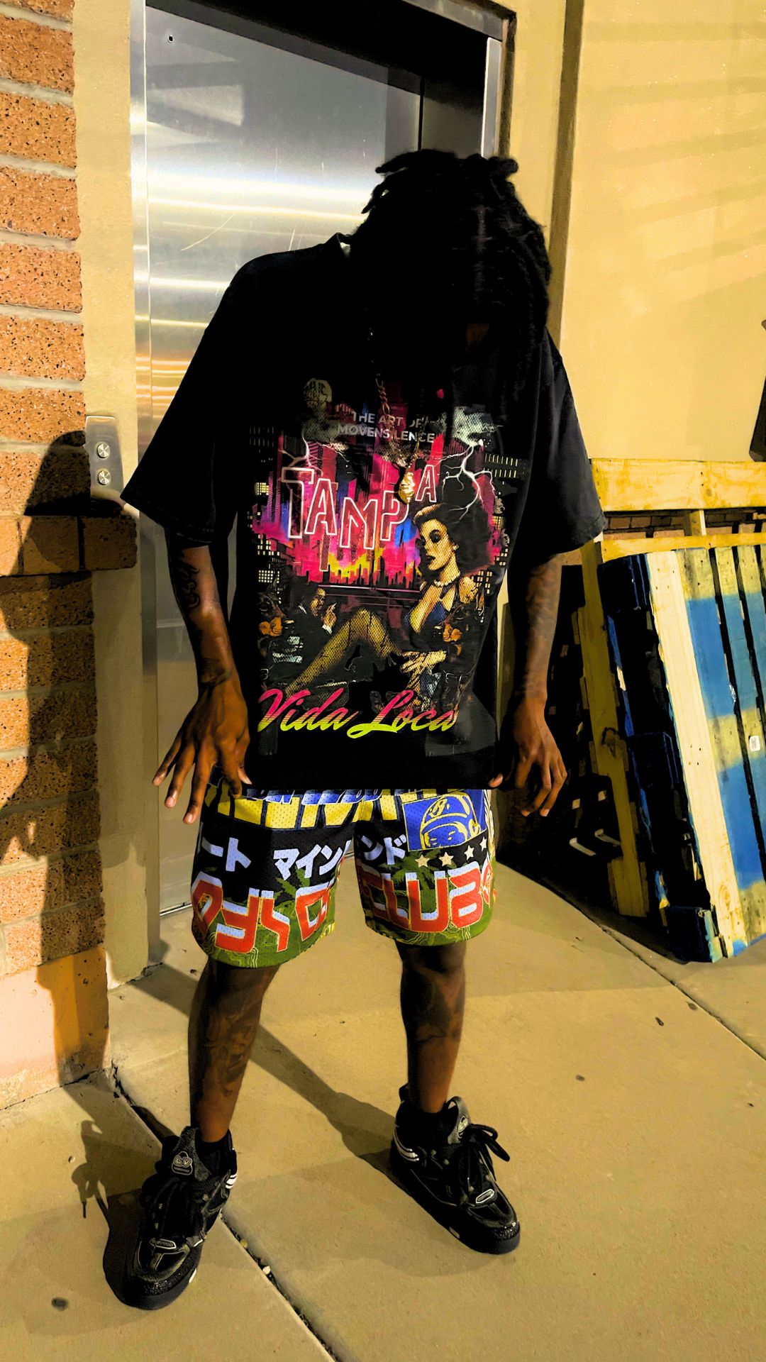 MNS Vida Loca Tampa Tee front print, neon Tampa skyline on washed black